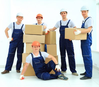 Home move with removal team handling furniture in Officeremovals