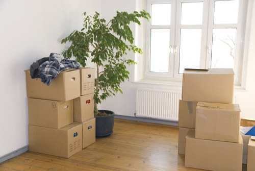 Office relocation with desks, boxes, and equipment being moved