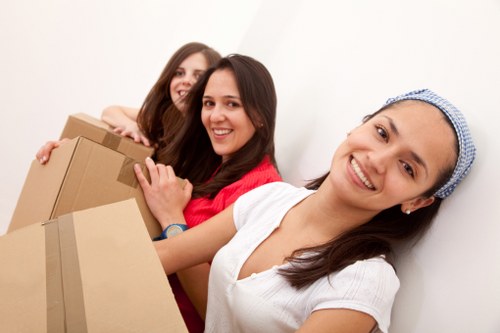 Business relocation team loading office furniture for transport