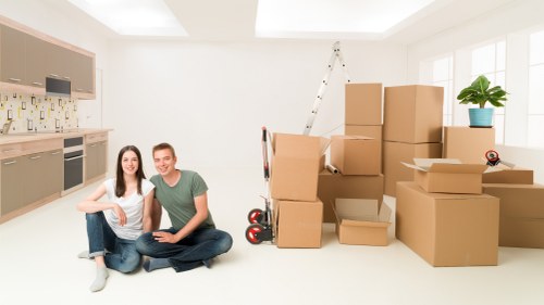 Team separating cardboard, metal, and other recyclables during a move