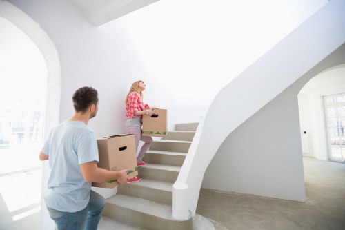 House movers loading boxes and appliances for a move in Officeremovals