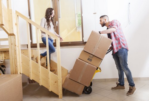 Furniture and boxes being loaded into a moving van in Officeremovals