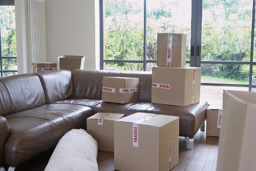 Packed household boxes and furniture ready for local removal services