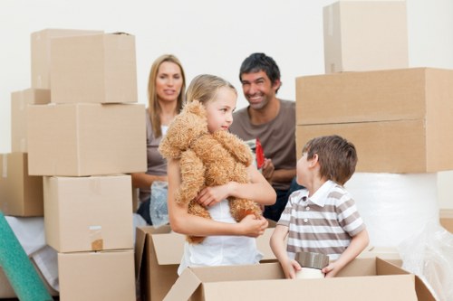 Packed household boxes and furniture ready for local removals service
